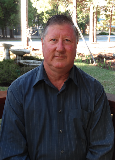 Man in button down shirt. Robin Simmons, author of family friendly fiction